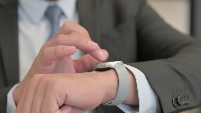 Close Up of Businessman Using Smart Watch