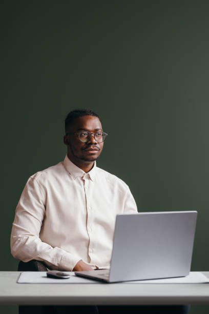istock Professional Man with Laptop at Modern Workplace 2087154869