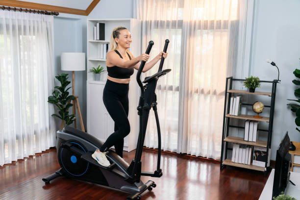 istock Active senior woman running on elliptical running machine. Clout 2087164707