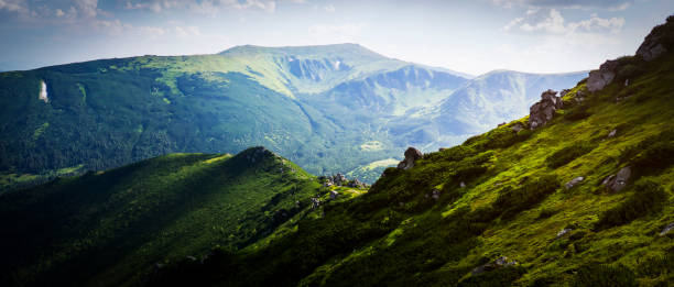 istock Green beautiful mountains in the sunny day. 2087168328