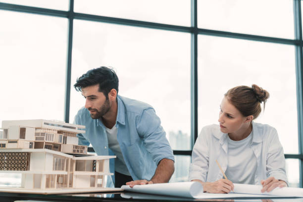 istock Professional architect team working together to design house model. Tracery. 2087247400