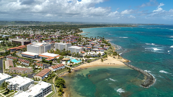 Aerial view of Dorado del Mar Beach Resort, in Dorado Beach, Puerto Rico. A coastal community with a mix of residential and a coastal tourist resort.