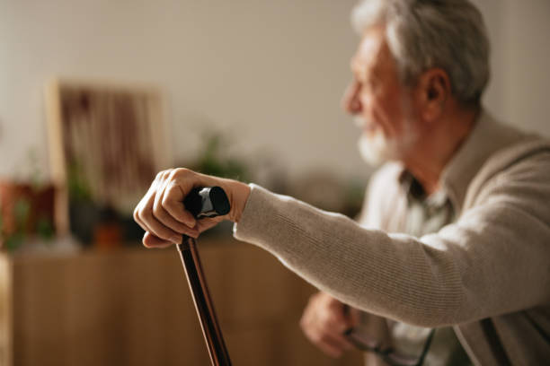 istock Unrecognizable Senior Man Holding a Walking Stick 2087259326