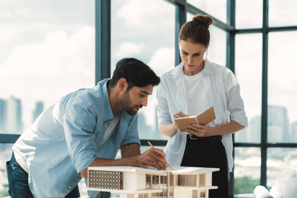 istock Smart architect engineer team working together to measure house model. Tracery. 2087262467