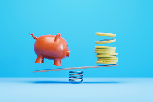 Piggy Bank and coins on Balance Board, finance concept. Digitally generated image. 3d render.
