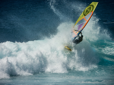 Hawaii, Maui, USA - March 15, 2024: Very talented windsurfing is doing some tricks in Maui - Hawaii.