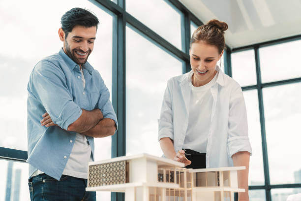 istock Smart architect engineer team working together to measure house model. Tracery. 2087337704