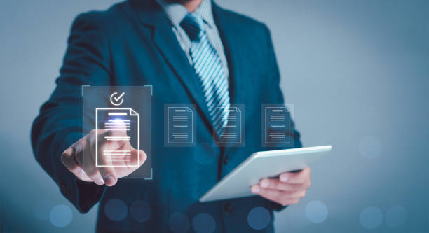 istock concept document managemente-signing, electronic signature, Paperless workplace. man touch file on virtual screen online documentation database and process automation to efficiently manage files. 2087342855