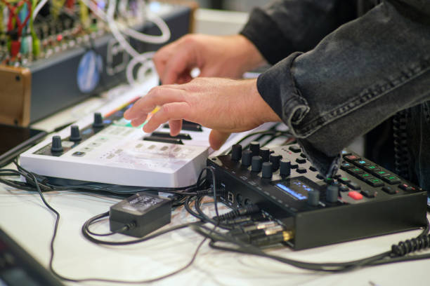 istock Sound engineer working on a digital sound mixer in a recording studio. 2087365264