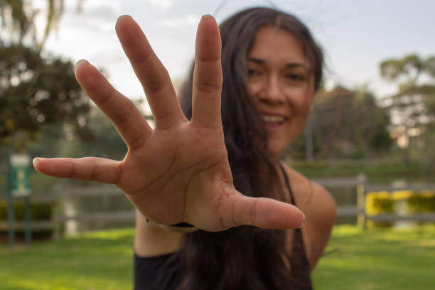 Beautiful young woman posing in a public park