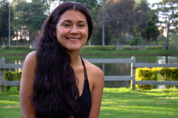 istock Beautiful young woman posing in a public park 2087413503