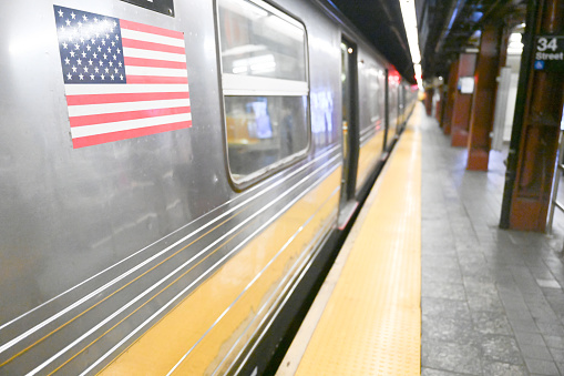 Close up on the American flag sticker on a train of the New York City subway.