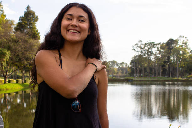 istock Beautiful young woman posing in a public park 2087454626