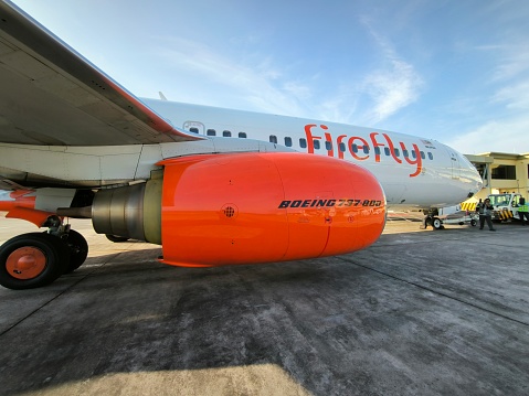 Banda Aceh, Aceh, Indonesia, February 18, 2024 - Firefly Malaysia Boeing 737-800 Next Generation with Orange color in the engine of the aircraft, boeing 737 are one of the most seller aircraft made by boeing America