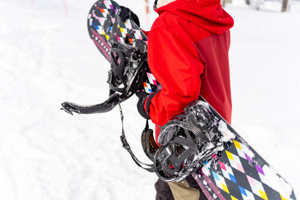 istock Asian woman practice snowboarding at ski area 2087494221