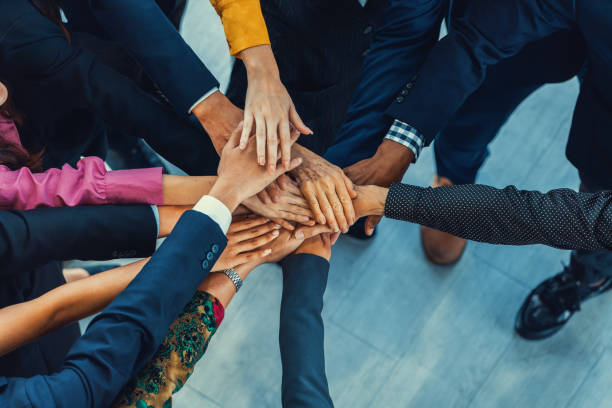 istock Diversity people putting their hands together. Showing unity. Intellectual. 2087524113