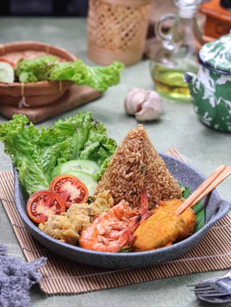 istock Tumpeng nasi goreng, fried rice shaped into a cone. 2087643662