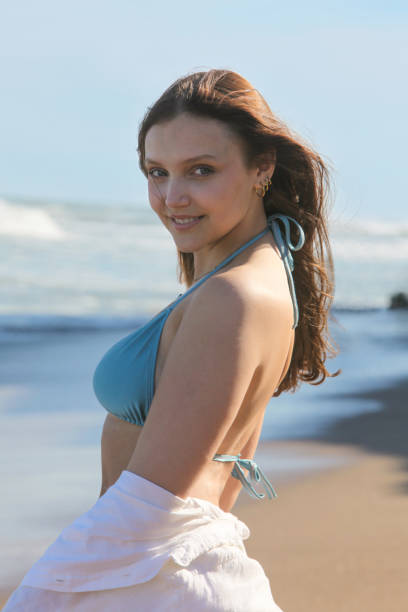 istock pretty girl at the beach 2087703058