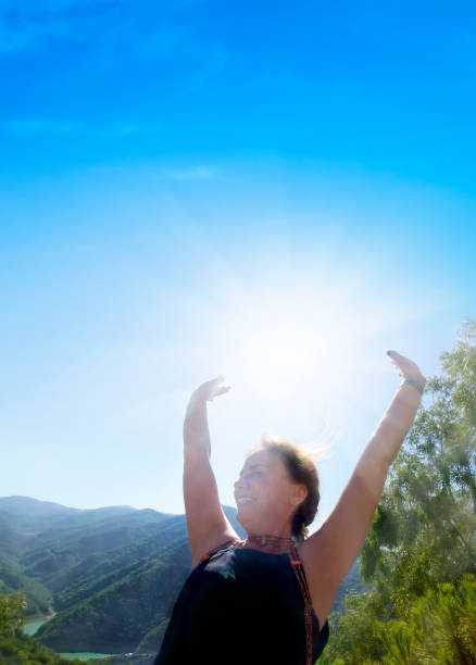 Portrait of beautiful mature woman in sunny springtime freshness