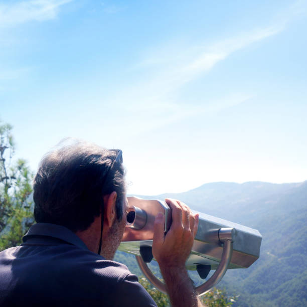 istock Mid adult man looking at view with coin operated binoculars 2087782953