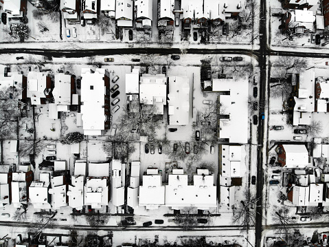 Aerial view of houses and streets in central Ottawa, Canada after a snowfall with snow covering roofs, yards and sidewalks
