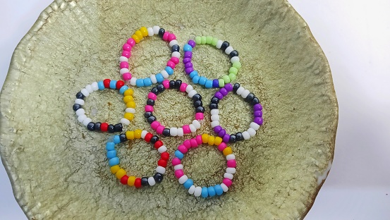 collection of cute colorful beaded rings. top of view.