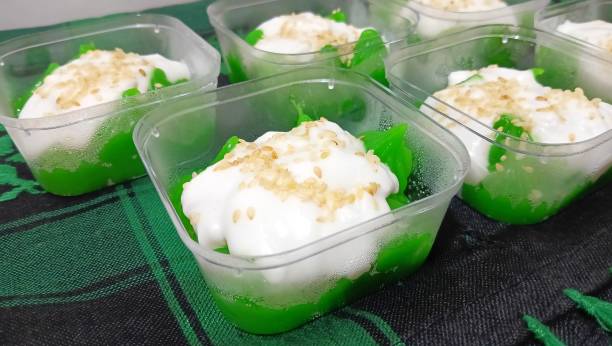 istock Thai dessert with coconut milk and sesame in a cup. 2087824524