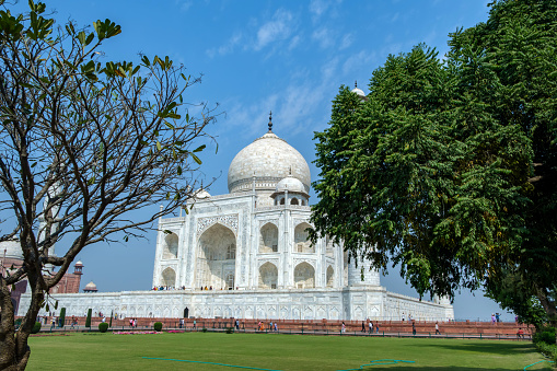 Agra, India - March 13 2024: The Taj Mahal at Agra India. It was commissioned in 1631 by the fifth Mughal emperor, Shah Jahan to house the tomb of his beloved wife, Mumtaz Mahal.