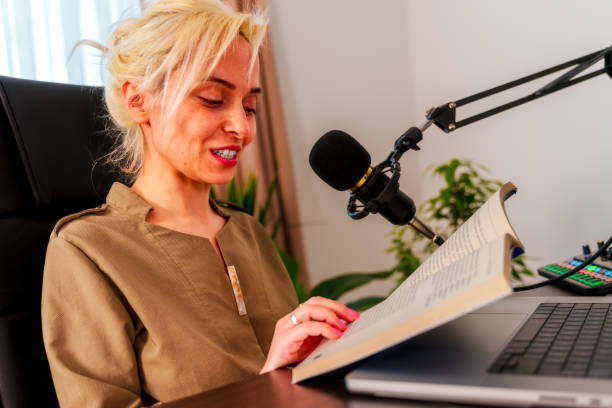 istock young woman recording podcast 2087917740