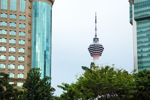 Cityscape and Menara Kuala Lumpur Tower over sky in Malaysia