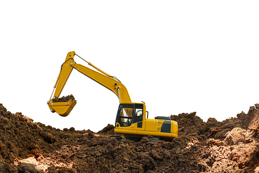 Excavator loader is digging in the construction site work with bucket lift up on white background