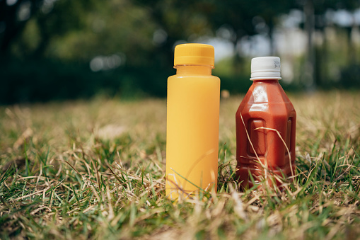 Bottles on the background of grass in the park