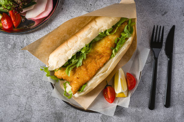 istock Fried fish sandwich with greens on the stone table. Turkish name Balik Ekmek 2088027103