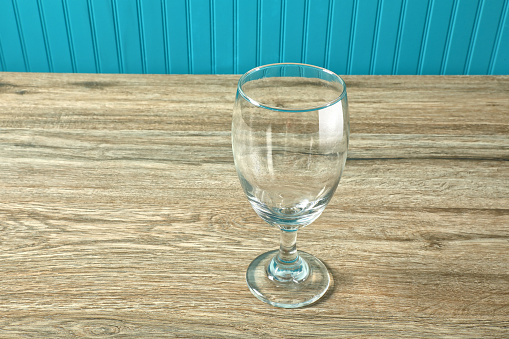 Close up of a Glass of Drinking Water on White Table
