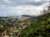 Aerial view cityscape of seaside Monaco with dramatic sky