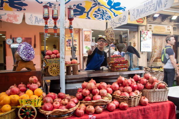 At Palermo, Italy, On october 2023, pomegranate juice vendor at Ballaro market