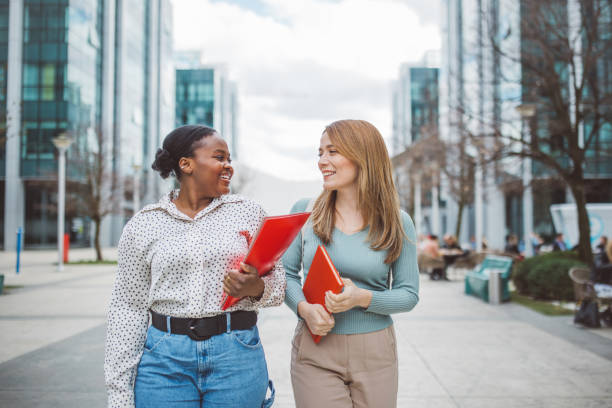 istock Young friends walking and talking 2088121959