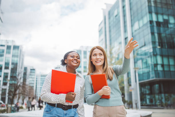 istock Young friends walking and talking 2088121965