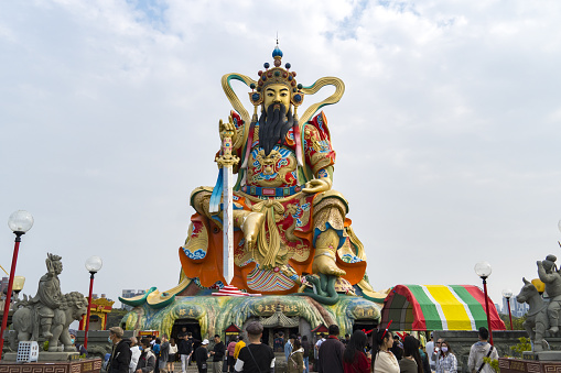 Kaohsiung, Taiwan - February 10, 2023: Mysterious Heavenly Upper Emperor statue, Xuan Wu, stands in Zuoying Yuandi Temple on Lotus Pond