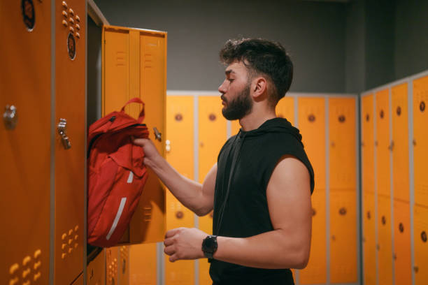 istock Young man in locker room, at the gym. 2088141807