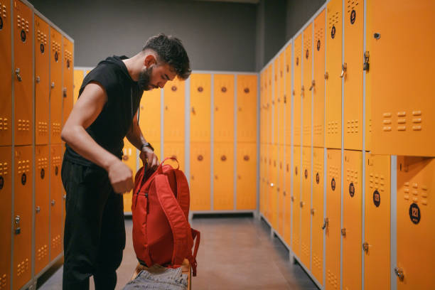istock Young man in locker room, at the gym. 2088141808