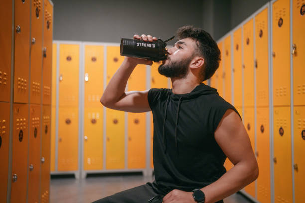 istock Young man in locker room, at the gym. 2088146933