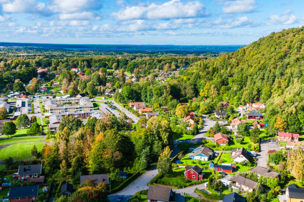 istock Aerial View of Town Surrounded by Trees 2088152133