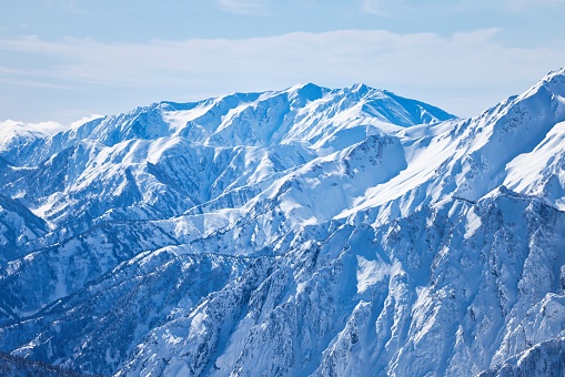 The ridgeline of the Northern Alps covered in snow in Japan