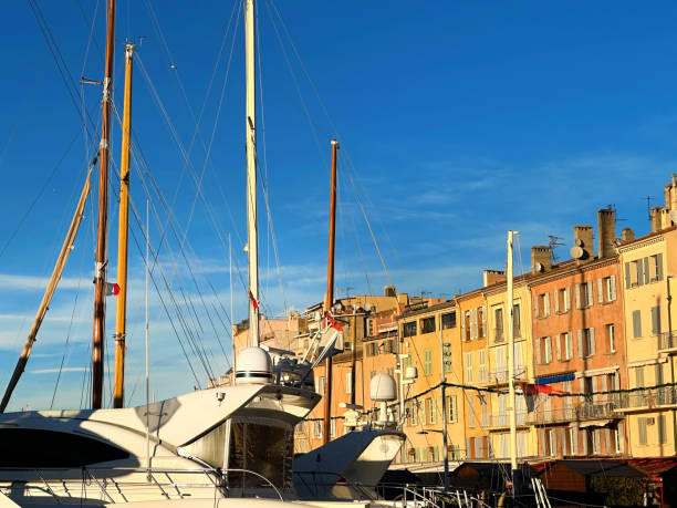Saint Tropez with typical, old, small fishing boats in the harbor in rainy weather, Cote d'Azur, French Riviera