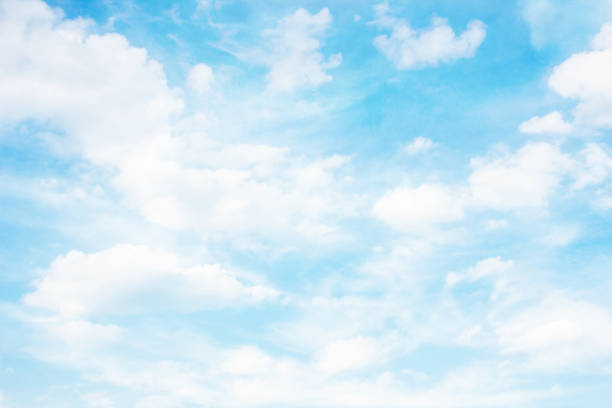 Heaven background. Cloudy sky background. Peaceful bright blue sky texture.