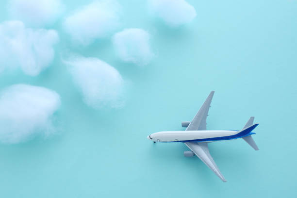 istock model of an airplane flying above the clouds 2088185921