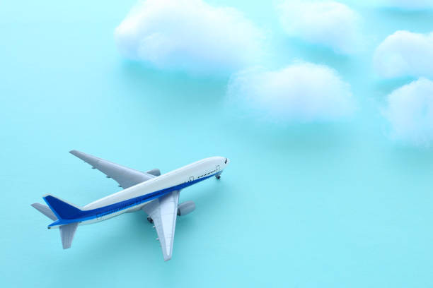 istock model of an airplane flying above the clouds 2088185925
