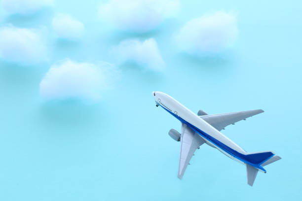 istock model of an airplane flying above the clouds 2088185926