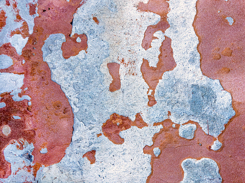 Close up abstract background image of peeled painted concrete wall texture